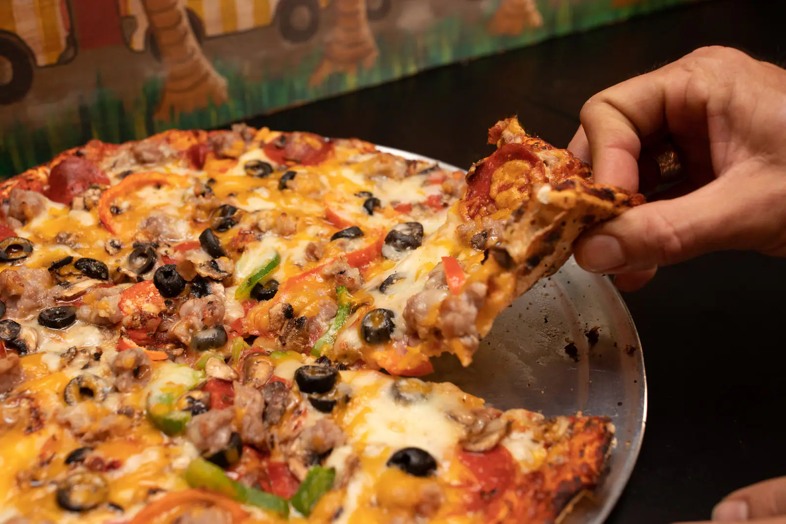 omp-large-combo-pizza-with-hand